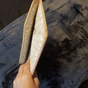 Mk clutch or an I pad or a small laptop case.